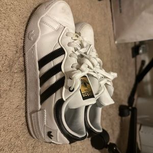 Black and white adidas shoes